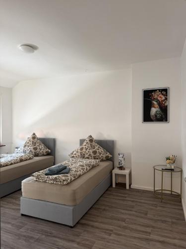 a bedroom with two beds in a room at Apartment Rotenburg in Rotenburg an der Fulda