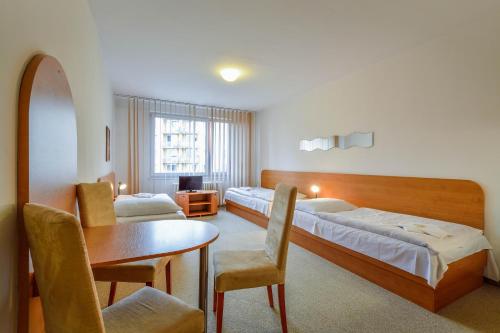 Posteľ alebo postele v izbe v ubytovaní Hotel Arnost Garni