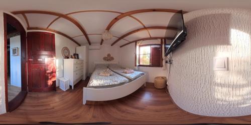 a bedroom with a large bed in a room at Vila Hedona in Donji Milanovac