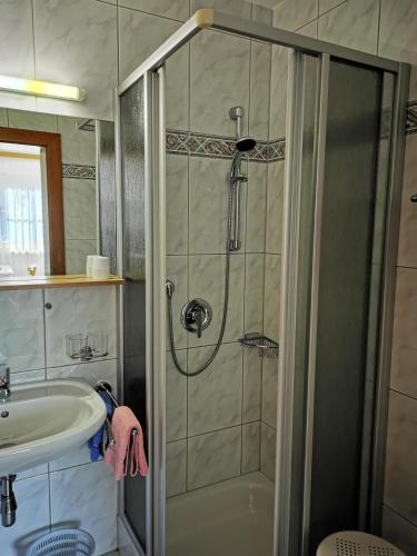 a bathroom with a shower and a sink at Balthasarhof, Haus in Finkenberg