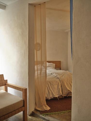 a bedroom with a bed and a window with a mirror at Noura Residency City Apartment II in Copenhagen