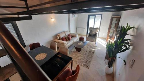 a living room with a couch and a table at Prestigieux appartement in Hammam Sousse