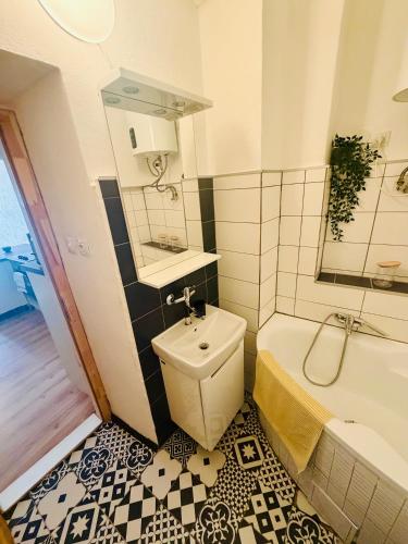 a bathroom with a toilet and a sink and a tub at Apartmány pod zvonicí, Vimperk in Vimperk