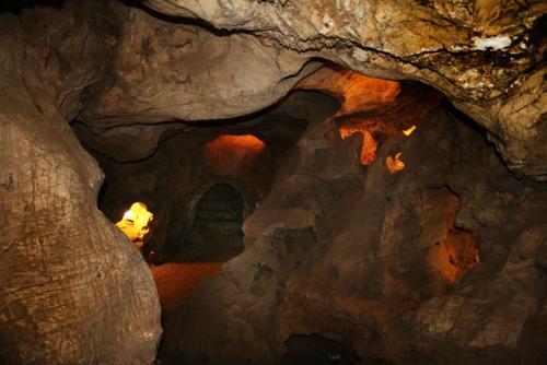 a cave with a fire inside of it at Casa d' Artista B&B in Ozieri