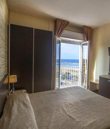 Säng eller sängar i ett rum på Hotel Massimo Resort