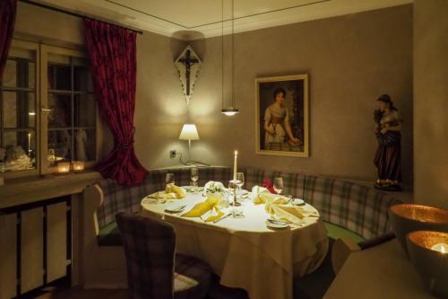 a dining room with a table with a candle on it at Hotel Restaurant Der Engel, Sasbachwalden in Sasbachwalden