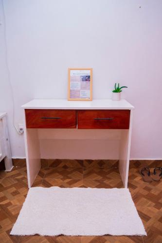 a white desk with a picture on top of it at MERED Haven Studio in Kilifi