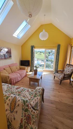 a living room with a couch and a table at Valley View Haven in Kingsbridge