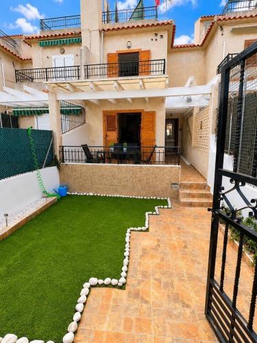 a house with a lawn in front of it at Villa Belén . in El Moncayo