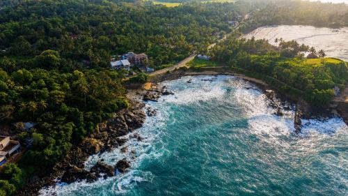 an aerial view of the shoreline of a beach at Coastal Breeze Talalla in Talalla South