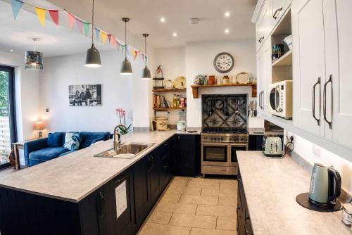 a kitchen with a sink and a counter top at Spacious Pretty home in Old Totterdown in Bristol