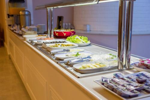 a buffet line with many plates of food on it at Bursa Palas Hotel in Bursa
