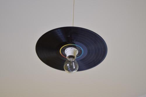 a vinyl record hanging from a ceiling at L'Aquilone B&B in Palermo