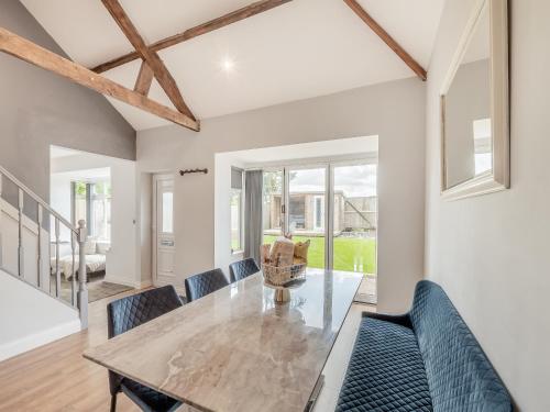 a dining room with a table and chairs at Vallum Villa - Uk40231 in Bardon Mill