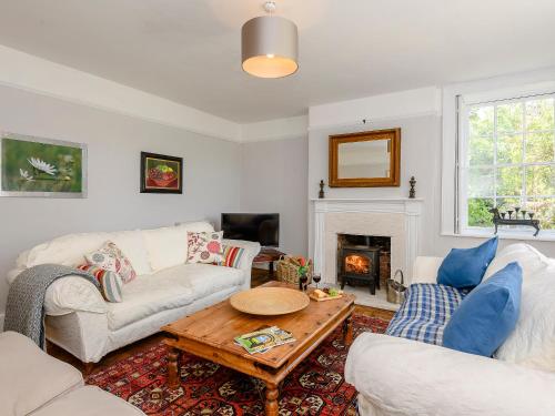 a living room with two couches and a coffee table at Colveston Manor in Cranwich
