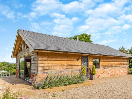 a log cabin with a slate roof at The Cwtch - Os7 in Newtown