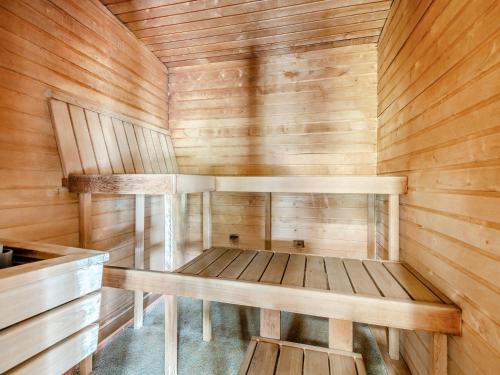 an empty sauna with wooden walls and wooden floors at Lodge - Uk49989 in Blandford Forum