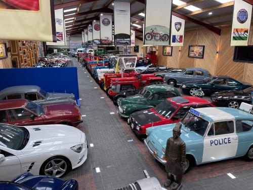 a group of cars parked in a garage at Tennox Stables - Uk39975 in Kilbirnie