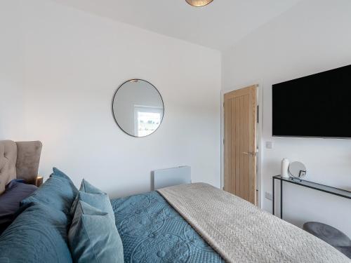 a bedroom with a bed and a flat screen tv at Trig View - Uk49915 in Bardon Mill