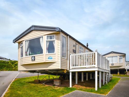 a house sitting on the side of a street at Elms 116 - Ukc9403 in Exmouth