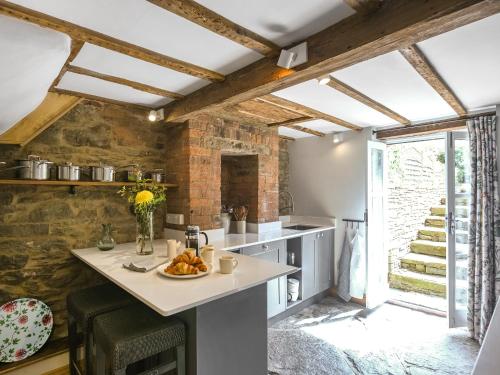 a kitchen with a table with a plate of food on it at The Haven in Ludlow