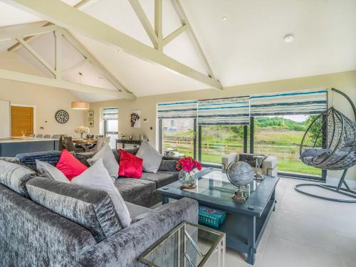 a living room with a couch and a table at Uk34190 - Gowan View in Arkholme