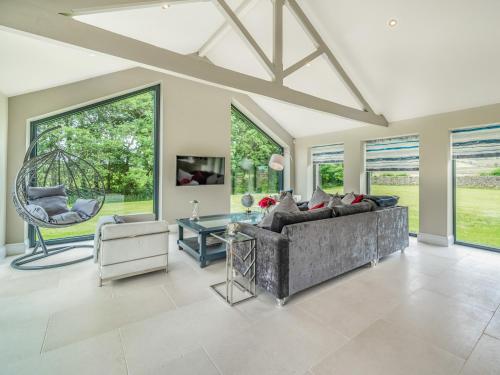 a living room with a couch and a table at Uk34190 - Gowan View in Arkholme