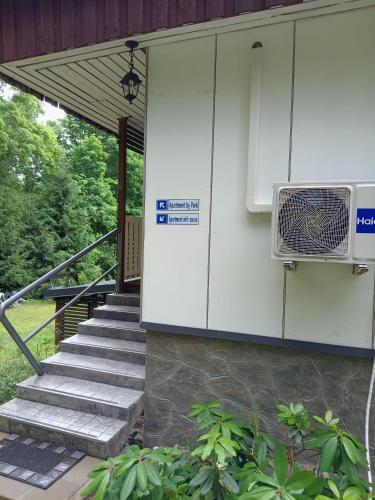 a building with stairs and a air conditioner at Apartment by the park in Imatra