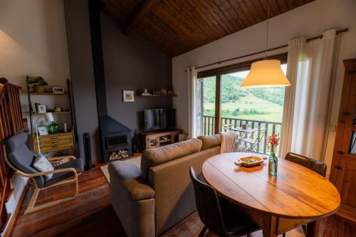 a living room with a couch and a table at CAN ROC in Camprodon