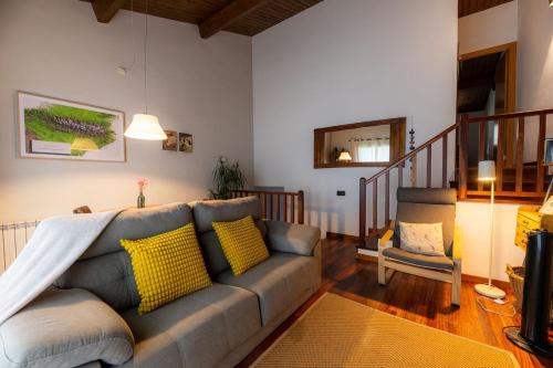 a living room with a couch and a chair at CAN ROC in Camprodon