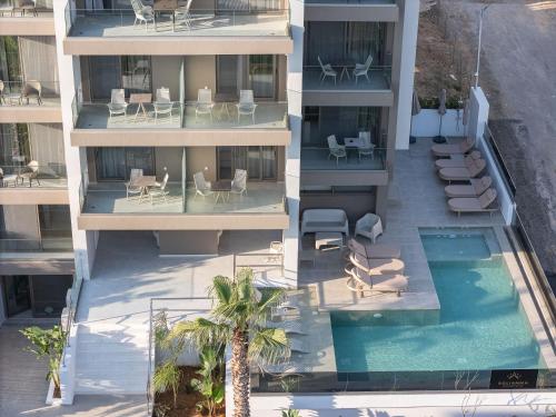 an aerial view of a building with a swimming pool at Solianna Rethymno Suites in Rethymno
