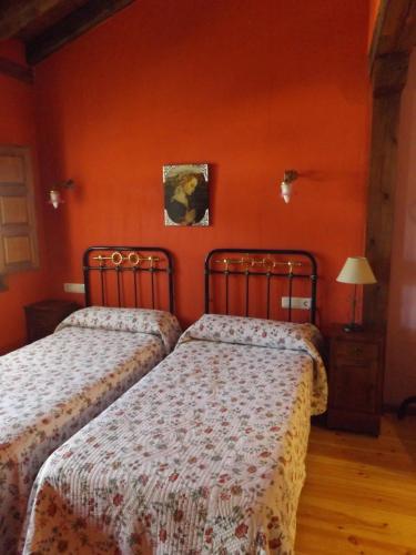 A bed or beds in a room at La Fragua de los Alvaro