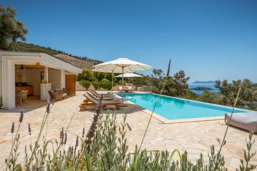 a villa with a swimming pool and a patio at Villa Dara and Todd in Sivota