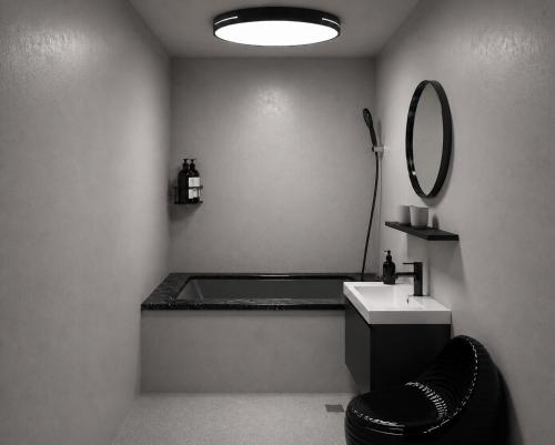a bathroom with a sink and a mirror at 礁溪希沐湯泉民宿 2026年7月全新面貌登場 價格優惠中 in Jiaoxi