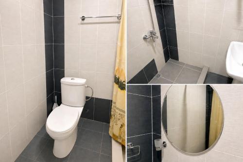 a bathroom with a toilet and a sink and a shower at Zanger Hotel in Goris