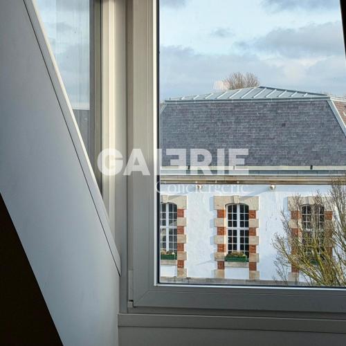 a window with a view of a building at GC - Les Oyats in Wissant