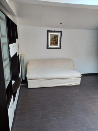 a bedroom with a white bed in a room at Scoglietti Loft in Ventimiglia