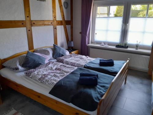 a bedroom with a bed with two pillows on it at Gerkenhof in Olsberg
