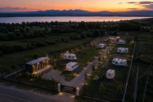 an aerial view of an rv park with a sunset at LakeSide Camping in Koplik