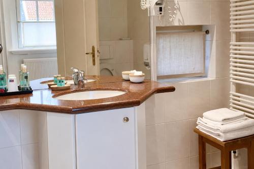 a bathroom with a sink and a shower at de Campveerse Toren in Veere