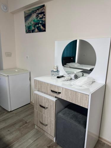 a bathroom with a sink and a mirror at Paradise House in Pamukkale