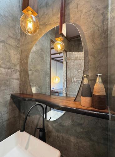 a bathroom with a sink and a mirror at CasaWa Homestay Hue in Thôn Trường Giang