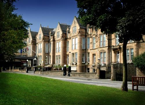a large building with a bench in front of it at JA The Bruntsfield - Edinburgh in Edinburgh
