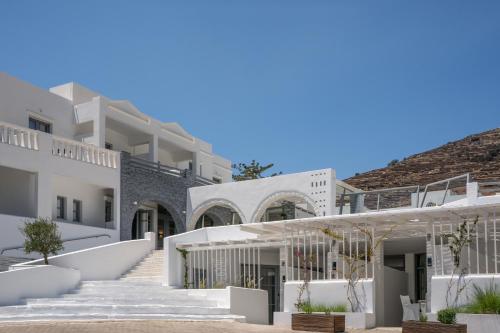 a group of white buildings with white stairs at Mr and Mrs White Tinos in Tinos