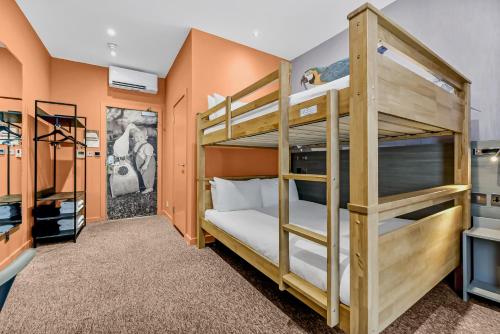 a bedroom with two bunk beds in a room at Heeton Concept Hotel - Kensington London in London