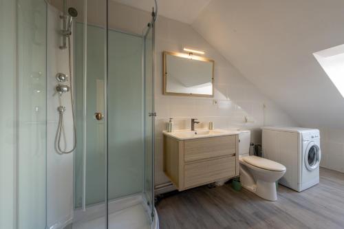 a bathroom with a sink toilet and a shower at Le Reflet de L'eau - Plages à proximité in Eu