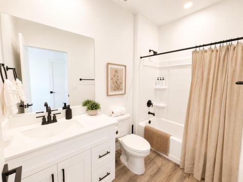 a white bathroom with a sink and a toilet at Desert View in Long Valleu in Washington