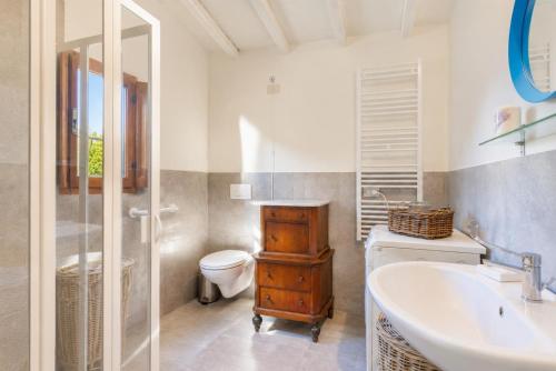 a bathroom with a sink and a toilet and a tub at Villa Le Balze Large Private Pool WiFi in Florence