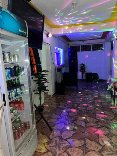 a room with a refrigerator with lights in it at BAYO-HOTEl in Cap-Haïtien