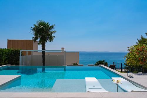 Seaview Villa ABA with 38sqm heated infinity pool, 4 bedrooms, Media room, 150m from sea